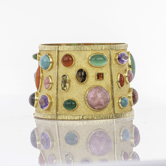 A Vintage Bangle with Colored Gemstone Trim