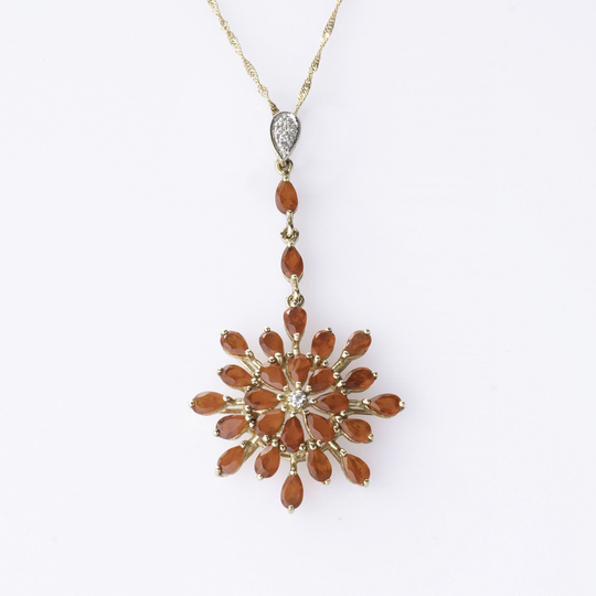 A flowershaped Fire Opal Pendant on Necklace