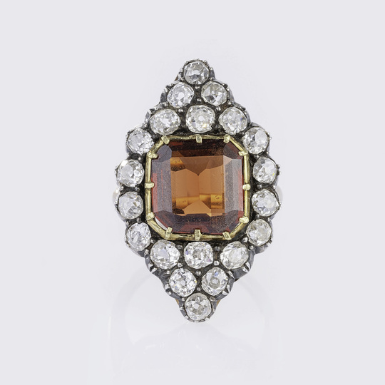 A large Art Nouveau Diamond Ring with Garnet