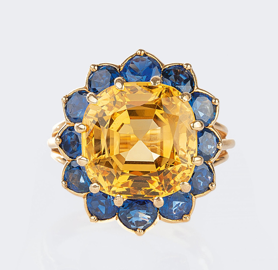 A rare, natural Yellow Sapphire Ring with blue Sapphires